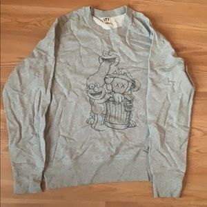 A Kaws x sesame street sweater / sweatshirt /